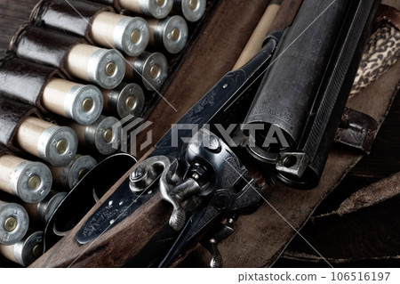 Antique 12-gauge break-action smooth-bored shotgun with paper cases. Antique 12-gauge break-action smooth-bored shotgun with paper cases. 106516197