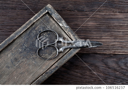 Antique wooden box and old vintage retro scissors. 106516237