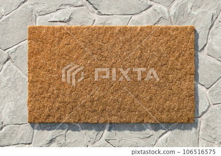 Overhead of blank doormat on the rock tile porch. 106516575