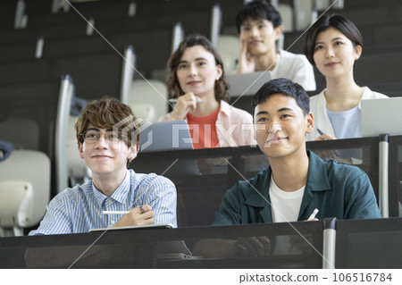 Male and female students taking classes 106516784