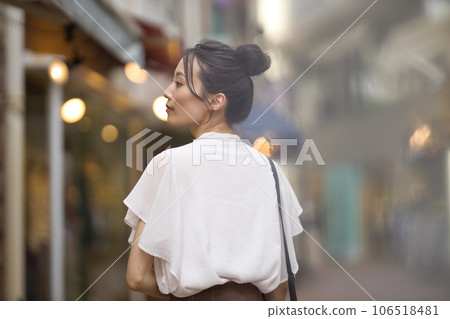 Young woman enjoying shopping in the city at sunset Young woman enjoying shopping in the city at sunset 106518481
