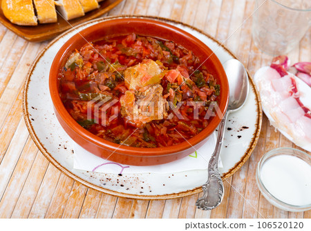 Portion of borsch served on table 106520120
