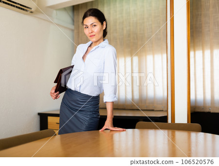 Portrait of young adult businesswoman at office Portrait of young adult businesswoman at office 106520576