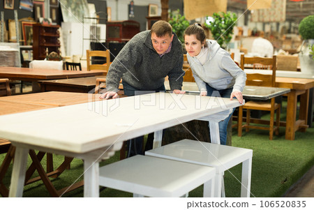 Couple visiting furniture store 106520835