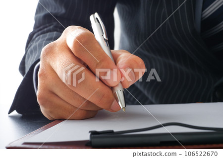 Business person signing documents Business person signing documents 106522670