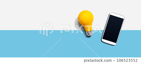 Smartphone with a yellow light bulb Smartphone with a yellow light bulb 106523552