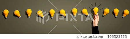 Many yellow light bulbs Many yellow light bulbs 106523553
