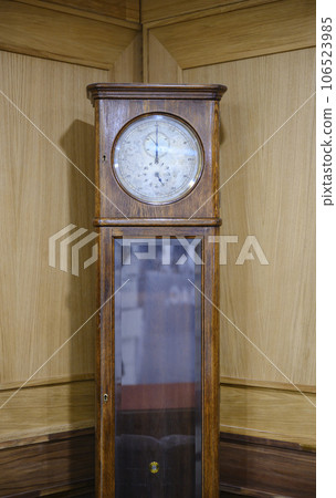 Grandfather clock in a wooden case manufactured in Glashuette, Germany, in the early 20th century Grandfather clock in a wooden case manufactured in Glashuette, Germany, in the early 20th century 106523985