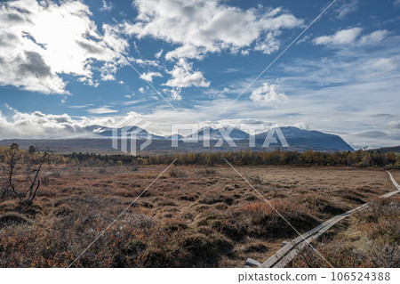 Sunny fall autumn view of Kungsleden Hiking path in Abisko National Park Kiruna Municipality Lapland Sweden Sunny fall autumn view of Kungsleden Hiking path in Abisko National Park Kiruna Municipality Lapland Sweden 106524388
