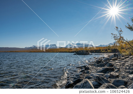 Autumn season in Abisko with Lake Tornetraesk in background, taken from Bjoerkliden, Swedish Lapland, Sweden Autumn season in Abisko with Lake Tornetraesk in background, taken from Bjoerkliden, Swedish Lapland, Sweden 106524426
