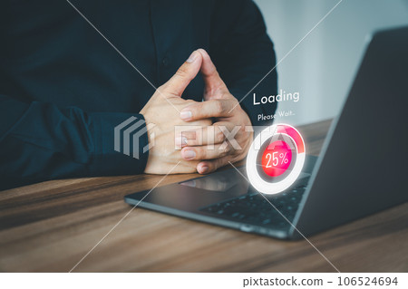 Adult man using a laptop computer for download and update software and waiting to loading digital file data form website, very slow internet form wifi. Concept of waiting for load of loading symbol. 106524694