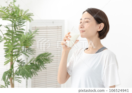 A woman drinking milk 106524941