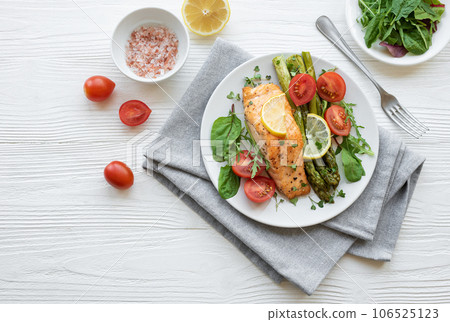 Baked Delicious salmon, green asparagus on plate Baked Delicious salmon, green asparagus on plate 106525123