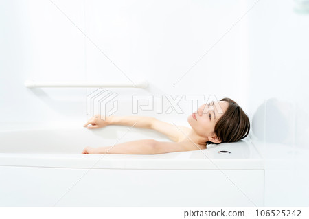 Woman taking a bath relaxing 106525242