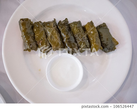 [Ukraine] Grape cigars and yogurt sauce served at a Tatar restaurant in the capital Kyiv 106526447