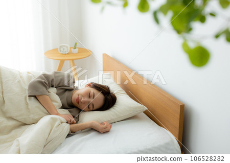 Woman in the bedroom, unwell 106528282
