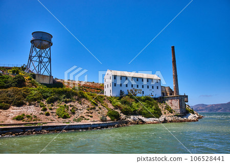 Close up view of Alcatraz Island East side with water tower and white building with Indian Land Close up view of Alcatraz Island East side with water tower and white building with Indian Land 106528441