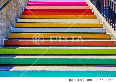 Close up view of solid colors on edge of pastel colored stairs 106528462