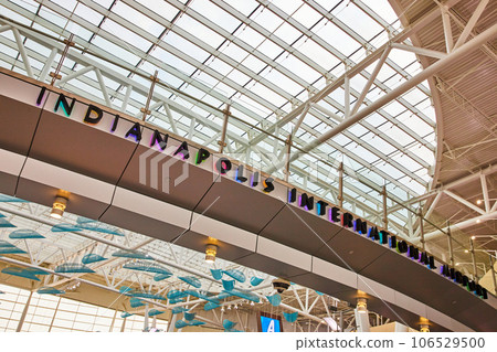 Indianapolis International Airport bridge multicolored lights behind sign 106529500