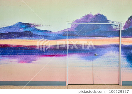 Abstract wall art creating sunset mountain scene across wall and door 106529527