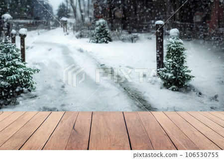 Empty wood table top on blur abstract of wild snow winter nature background, for montage product display, 3d rendering Empty wood table top on blur abstract of wild snow winter nature background, for montage product display, 3d rendering 106530755