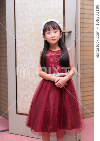 Elementary school girl in a dress 106531199