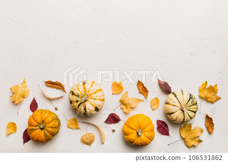 Autumn composition. Pattern made of dried leaves and other design accessories on table. Flat lay, top view 106531862