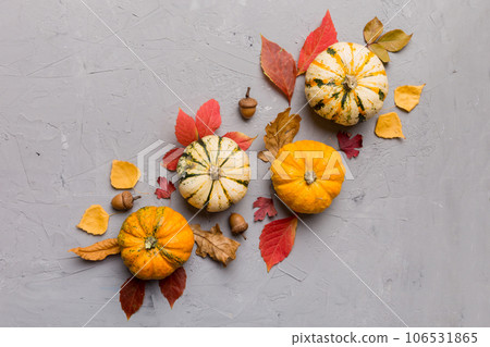 Autumn composition. Pattern made of dried leaves and other design accessories on table. Flat lay, top view 106531865