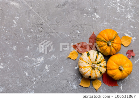 Autumn composition. Pattern made of dried leaves and other design accessories on table. Flat lay, top view Autumn composition. Pattern made of dried leaves and other design accessories on table. Flat lay, top view 106531867