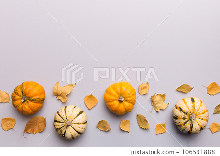 Autumn composition. Pattern made of dried leaves and other design accessories on table. Flat lay, top view 106531888