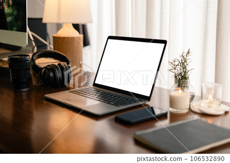 Laptop with blank screen on wooden table Laptop with blank screen on wooden table 106532890
