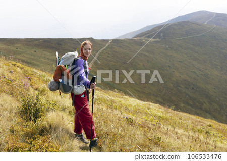 girl tourist on the background of a mountain landscape girl tourist on the background of a mountain landscape 106533476