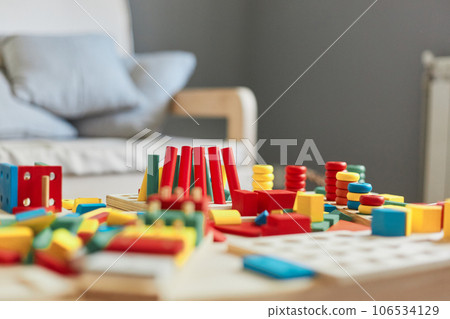 Kindergarten play space with colorful wooden educational toys. 106534129