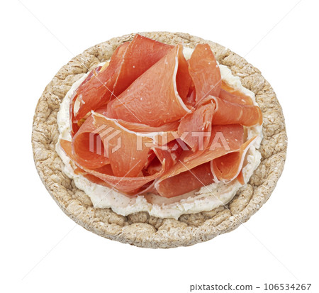 Puffed rice cake with cream cheese and smoked ham isolated on white background, top view 106534267