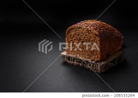 Delicious fresh crispy brown bread with grains and seeds Delicious fresh crispy brown bread with grains and seeds 106535264