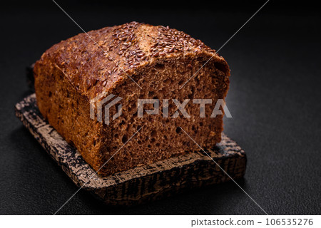 Delicious fresh crispy brown bread with grains and seeds 106535276