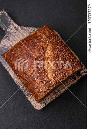 Delicious fresh crispy brown bread with grains and seeds Delicious fresh crispy brown bread with grains and seeds 106535279