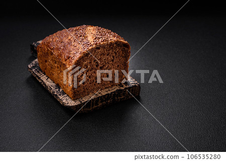 Delicious fresh crispy brown bread with grains and seeds Delicious fresh crispy brown bread with grains and seeds 106535280