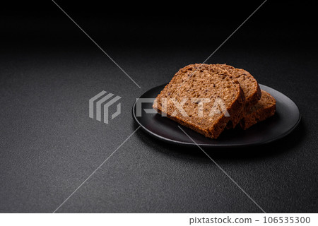 Delicious fresh crispy brown bread with grains and seeds Delicious fresh crispy brown bread with grains and seeds 106535300