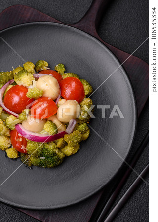 Delicious fresh salad with broccoli, cherry tomatoes, mushrooms, onions, salt, spices and herbs Delicious fresh salad with broccoli, cherry tomatoes, mushrooms, onions, salt, spices and herbs 106535334