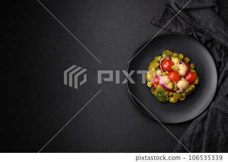 Delicious fresh salad with broccoli, cherry tomatoes, mushrooms, onions, salt, spices and herbs Delicious fresh salad with broccoli, cherry tomatoes, mushrooms, onions, salt, spices and herbs 106535339