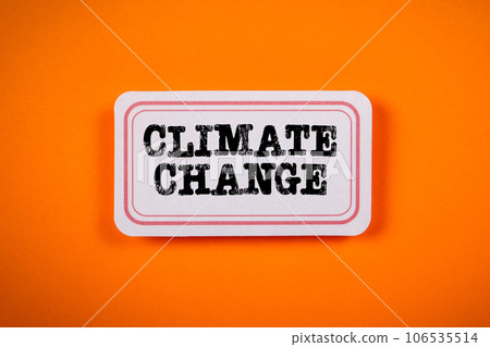 Climate Change Concept. Sticky note with text on an orange background Climate Change Concept. Sticky note with text on an orange background 106535514