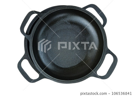 Cast iron pans. Rustic cookware. Kitchenwares isolated on white background. Top view. Cast iron pans. Rustic cookware. Kitchenwares isolated on white background. Top view. 106536841