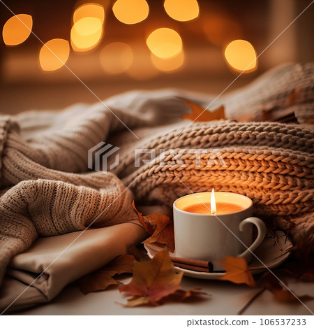 Fall aesthetics, autumn interior decor with cozy blanket and burning candles 106537233