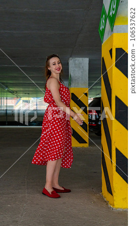 girl in a red dress in white polka dots 106537622