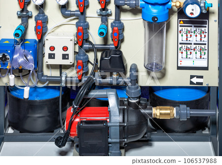 Surface centrifugal pump against the background of the water supply wiring diagram. 106537988