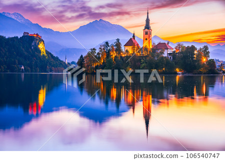 Bled, Slovenia - Sunrise with Julian Alps and Church Santa Maria, beautiful Europe. 106540747