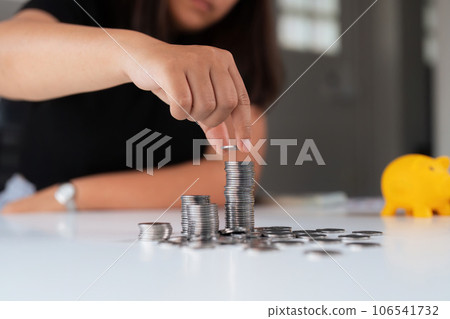 Business women put coin stack money and many bank note in office, Save money for future and Retirement 106541732