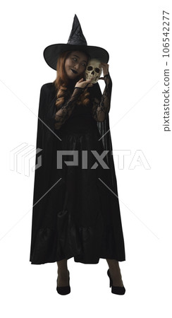 Halloween witch holding a skull Halloween witch holding a skull 106542277