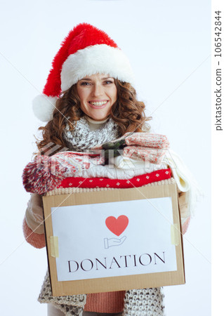 happy stylish female in sweater, mittens, hat and scarf 106542844